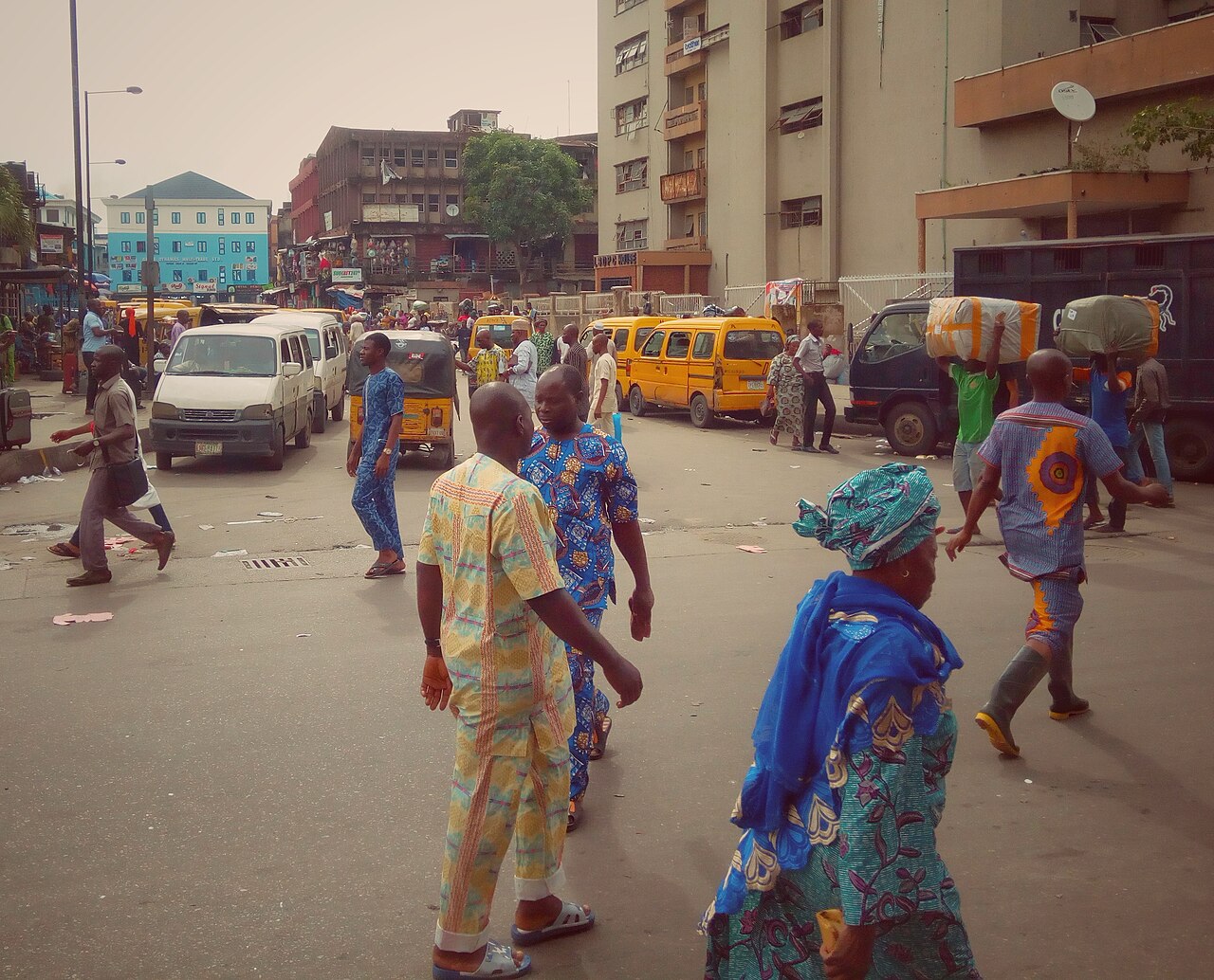 People walking through Tejuoso Market in Lagos, Nigeria