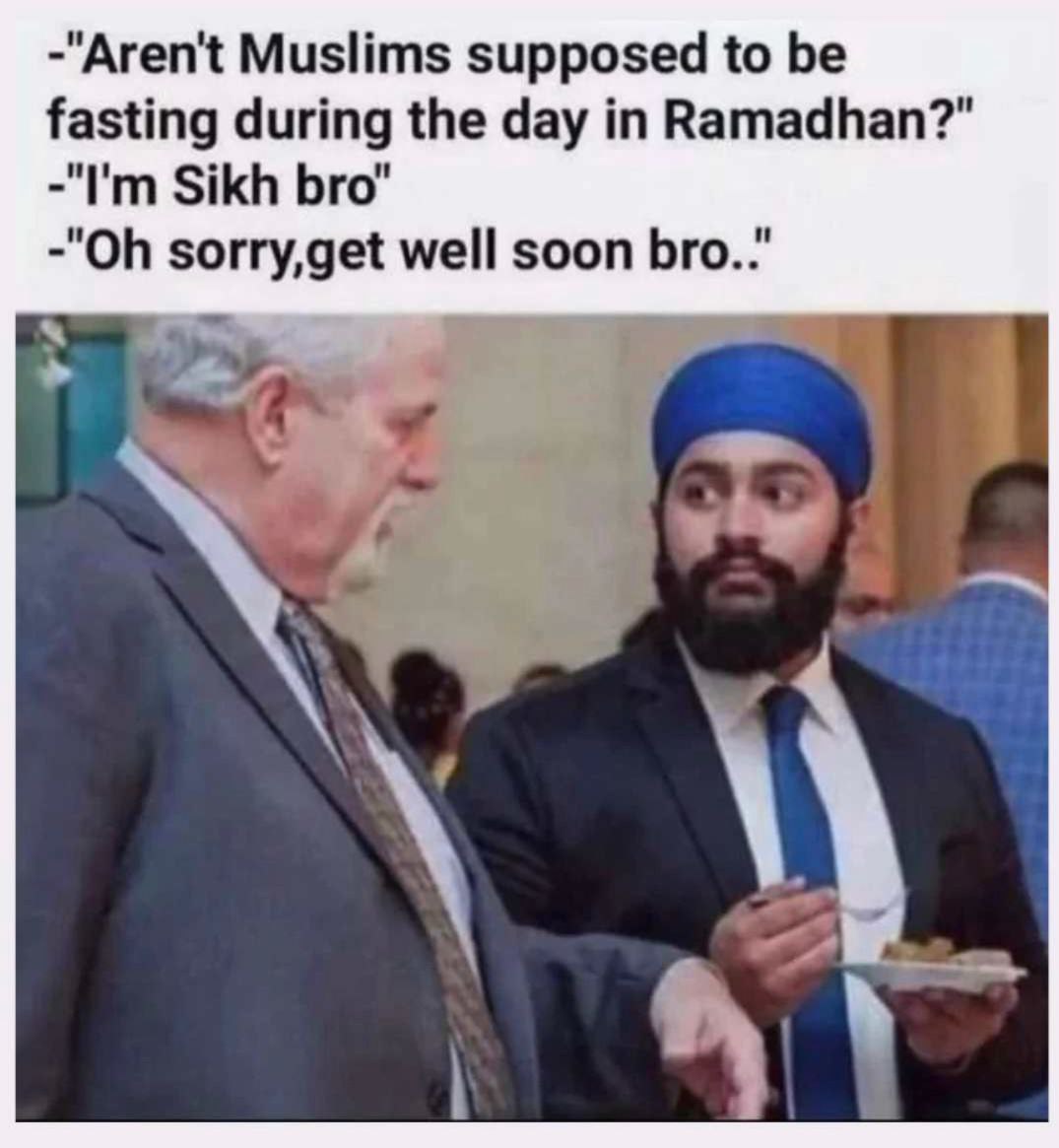 a man in a tuk is talking to another man