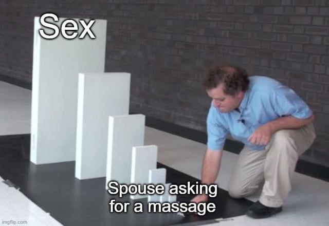 a man kneeling down on a black floor