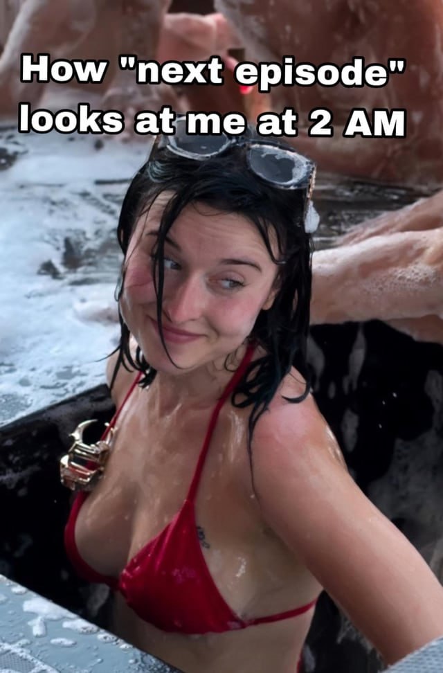 a woman in a red bikini is in the water