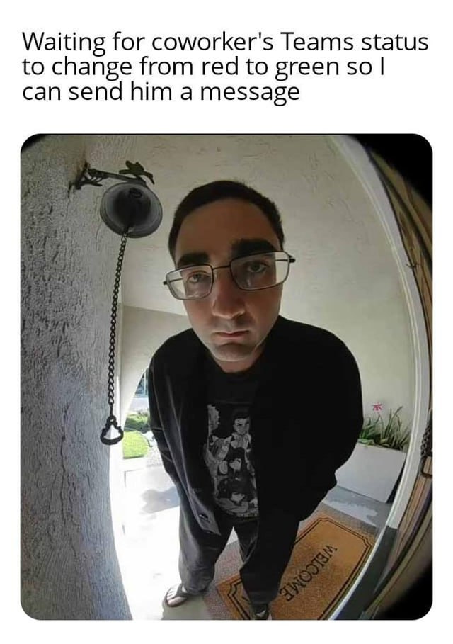 a man in glasses is looking at the camera
