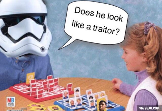 a little girl sitting at a table with a storm trooper