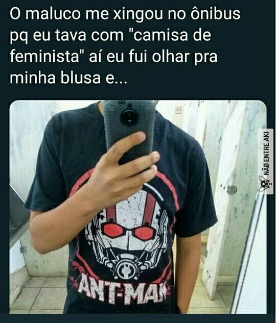 a man in a black shirt is taking a selfie