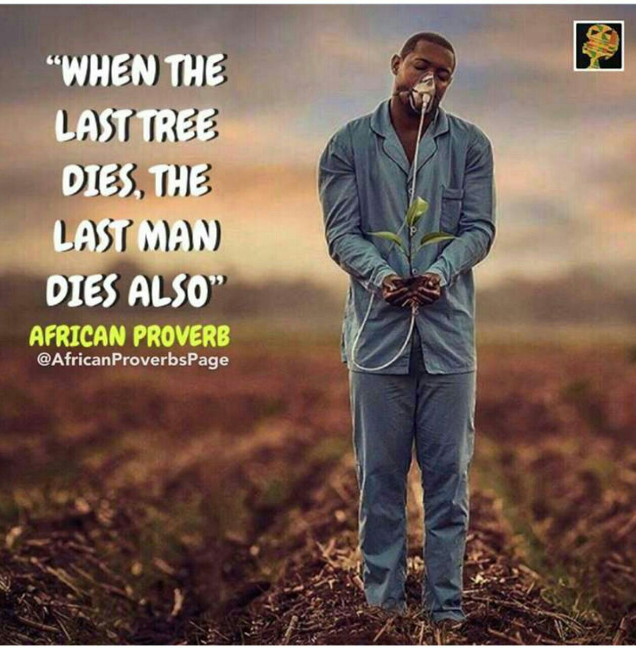 a man in a blue suit standing in a field