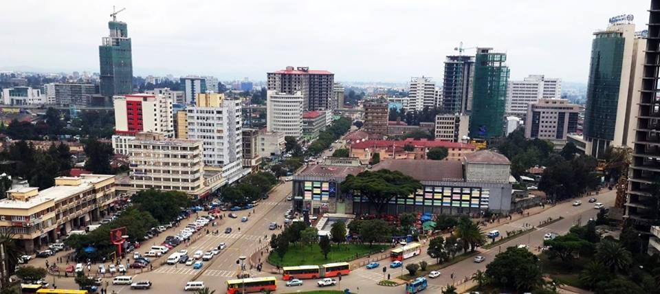 a city with many buildings and cars