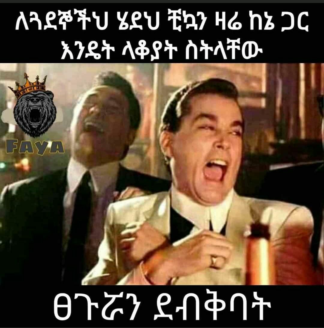 a man in a suit and tie is yelling at another